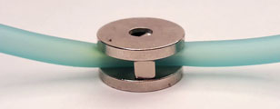 Tubing through magnets